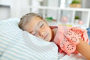 Little girl sleeping in her room at home