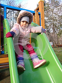 Little girl on a slide