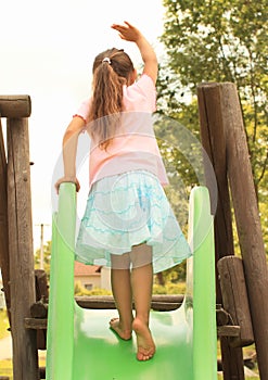 Little girl on a slide