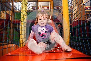 Little girl on a slide