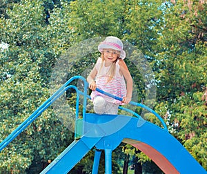 Little girl on the slide