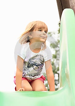 Little girl on a slide