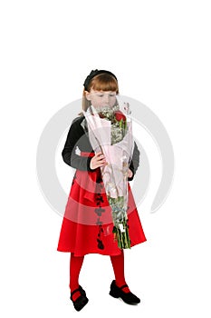 Little girl smelling a bouquet of roses