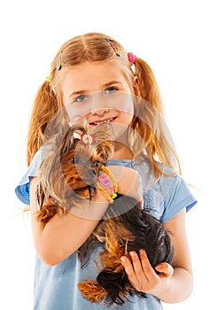 Little girl smile and hold cute small dog