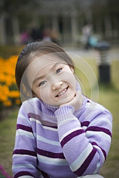 Little girl smiles pleasantly
