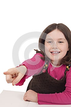 Little girl smiling and pointing