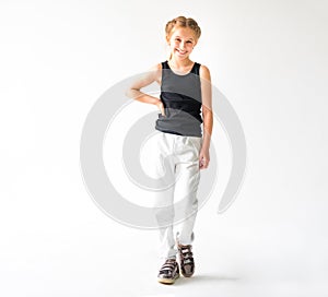 Little girl smiling standing in front of camera