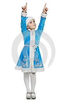 Little girl snow maiden pointing up