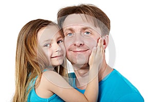 Little girl snuggle her cheek to father