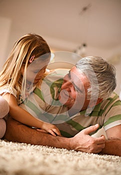 Little girl spending time with her grandpa.