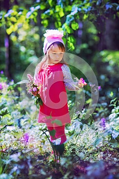 Little girl in sping forest