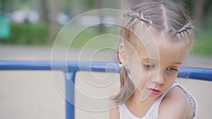 Little Girl Spinning Merry Go Round Carousel Amusement Park Playground Summer Day