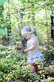Little girl in spring forest