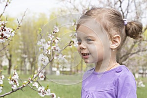 Little girl in a spring garden