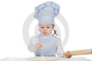 Little girl sprinkle flour on pizza dough