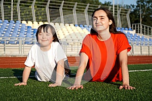 Little girl on the stadium with a coach