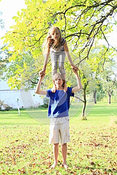 Little girl standing on boy