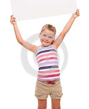 Little girl is standing on white background and holding white ca