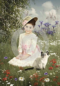 Little girl in a straw hat and kitten