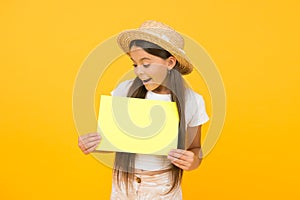 Little girl straw hat showing blank paper copy space, summer shopping concept