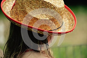 Little girl in the straw hat in spring in NH