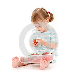 Little girl with strawberry