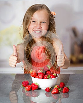 Little girl with strawberry