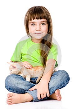 Little girl stroking a kitten. isolated on white background