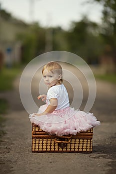 Little girl with suitcase