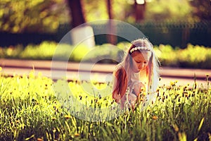 Little girl in summer meadow