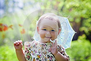 Little girl with sun umbrella