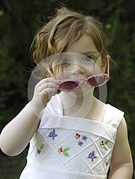 Little girl in sunglasses