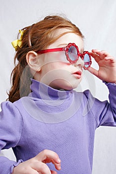 Little girl in sunglasses