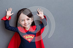 Little girl superhero. Portrait of happy kid with smile on face in fantastic costume. Generative AI.