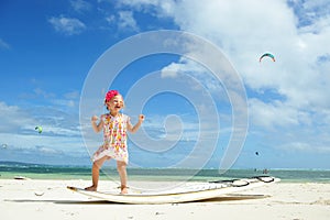 Little girl on surfboard