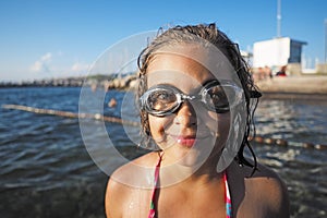 Little girl with swimming glasses