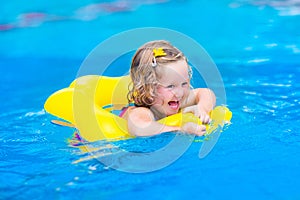 Little girl in swimming pool