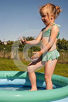 Little girl in swimming pool