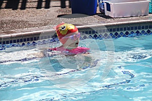 Little girl swimming in pool