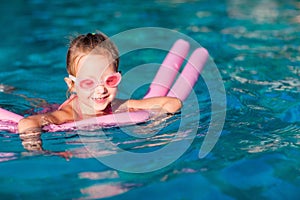 Little girl at swimming pool