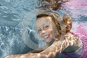 Little girl swimming underwater