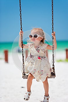 Little girl swinging