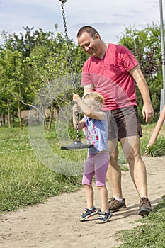 Little girl swinging