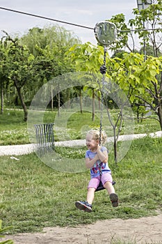 Little girl swinging