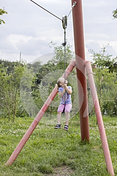 Little girl swinging