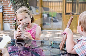 Little Girl Taking a Bite Out of a Chocolate Bunny