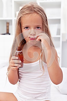 Little girl taking medication