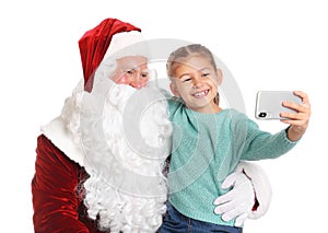 Little girl taking selfie with authentic Santa Claus on white