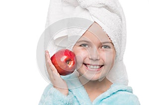 little girl after taking a shower holding red apple beside her c