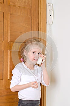 Little girl talking on the intercom
